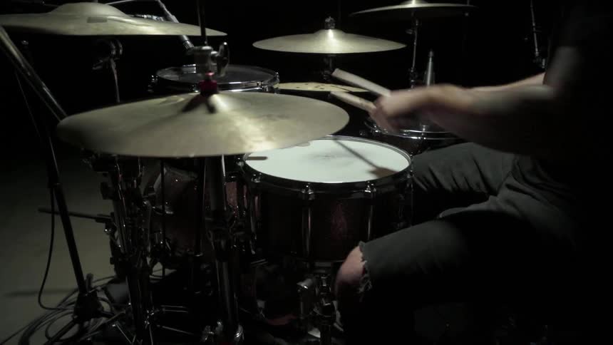 Drummer is playing on his drums
