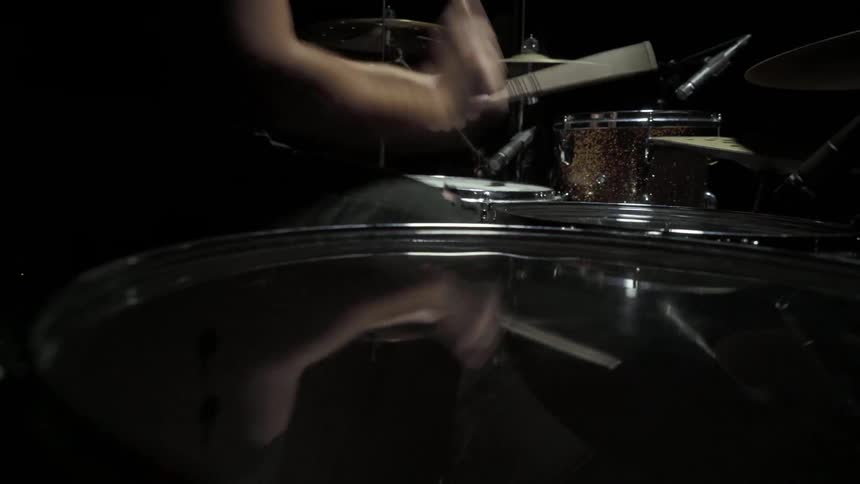 Drummer plays drums