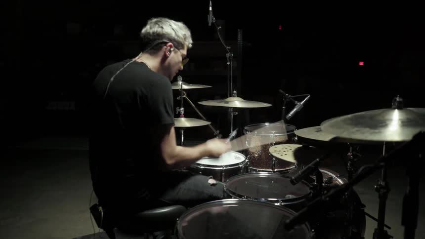 Drummer is playing on his drums