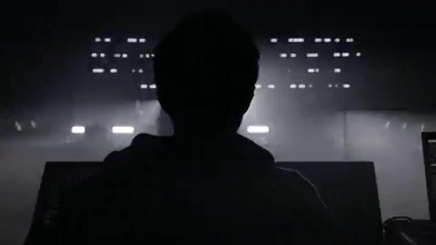 Lights flash in front of a person wearing glasses