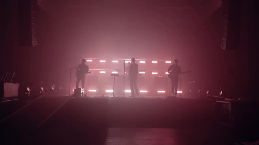 A band practices on the stage