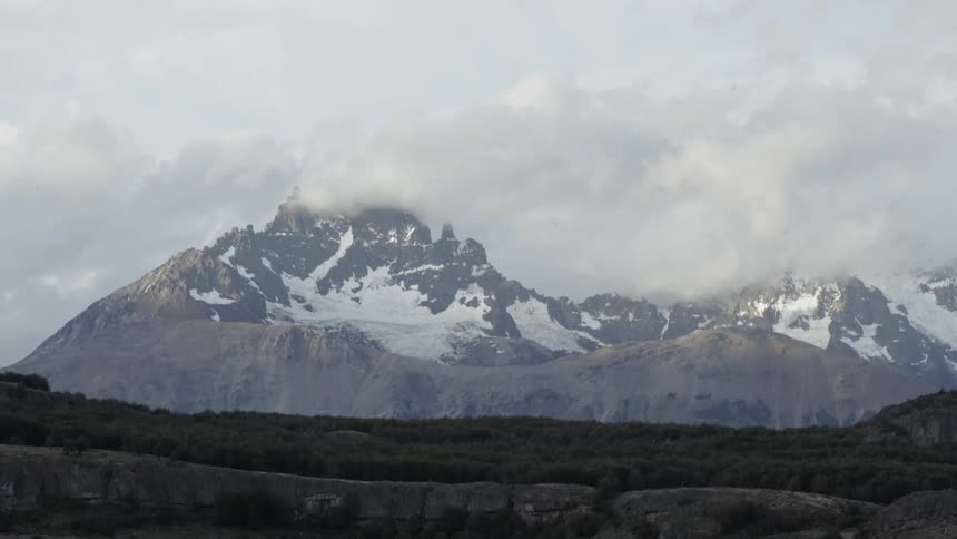 Mountains at daytime with the sky and clouds in the background
