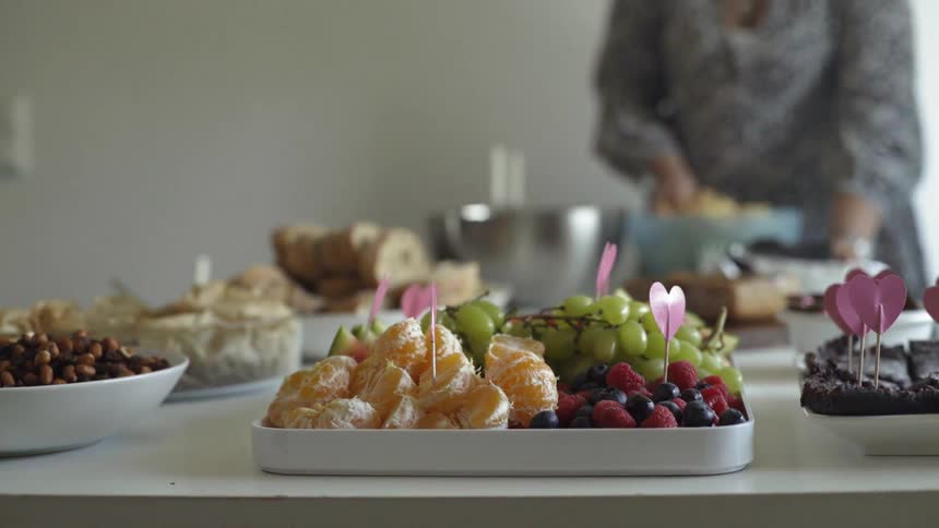 A tray of various fruits sit on a table