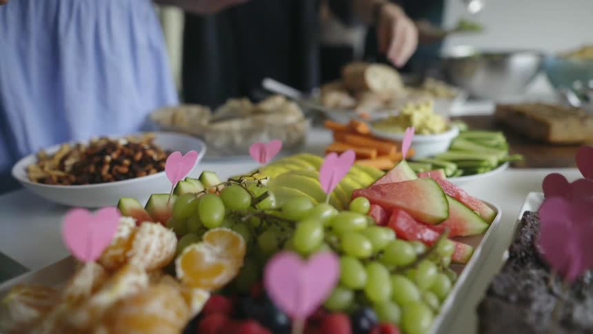 People take food off of a table