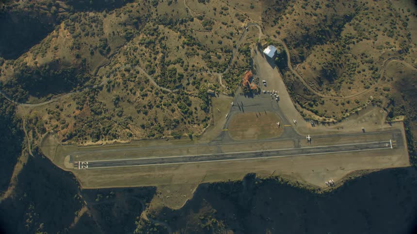 An airplane taxis for take off on Catalina runway