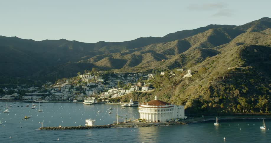 Small town in coastal bay with boats during golden hour, Avalon Harbor, Catalina