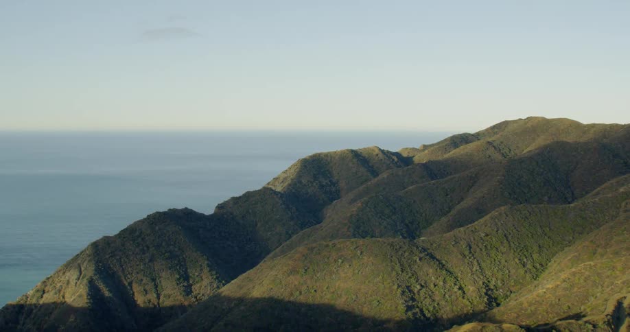 Skimming mountain tops along the ocean