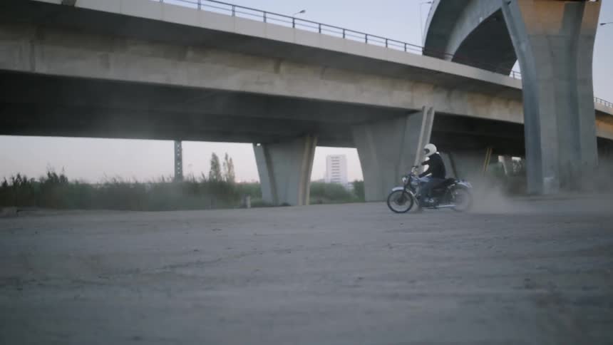 A person rides their motorcycle in circles