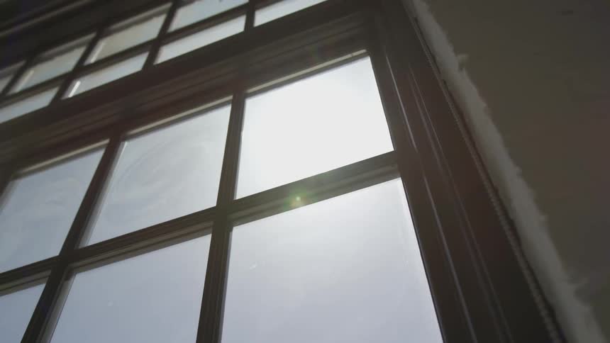 The sun shines through a window