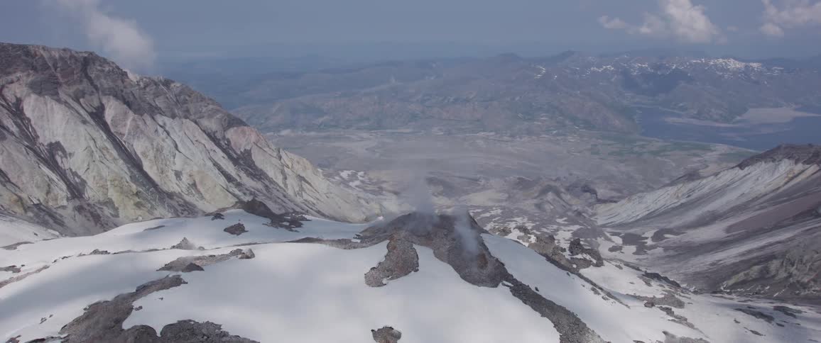 Aerial view of a mountain range covered in snow