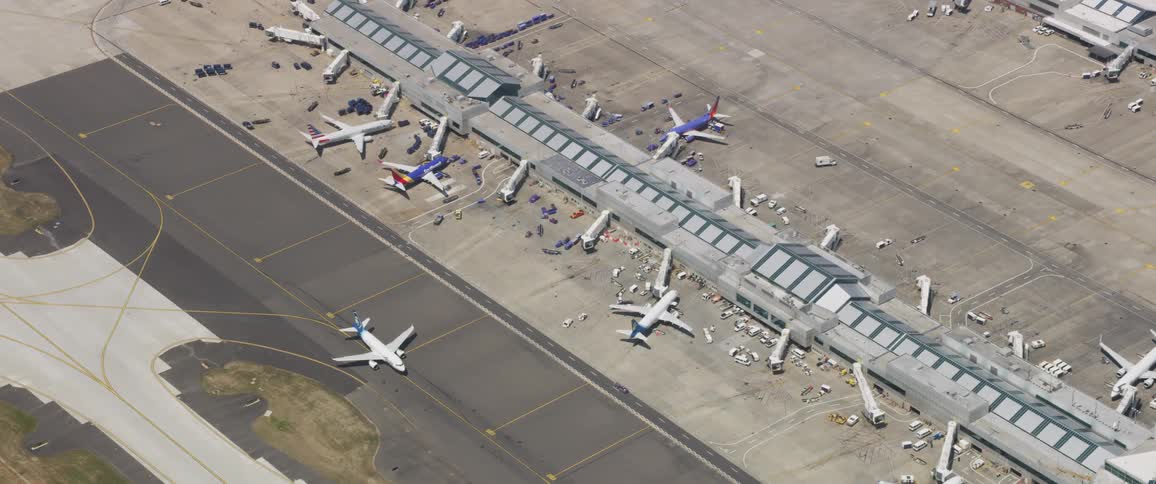 Airplanes on tarmac near airport terminal