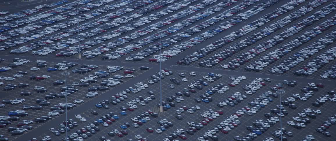 Several cars are parked in a parking lot