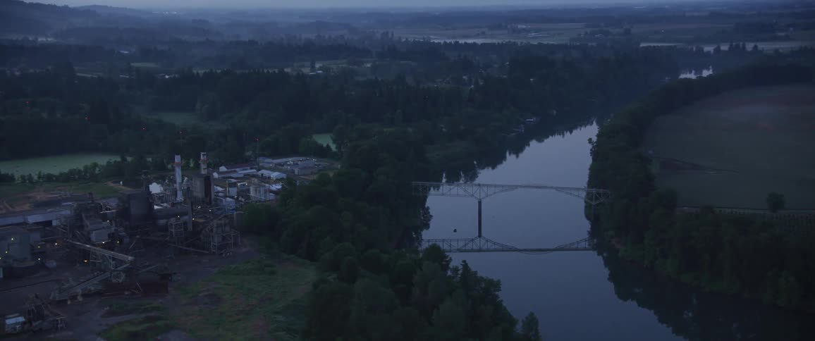 Aerial view of a river bed and industrial area