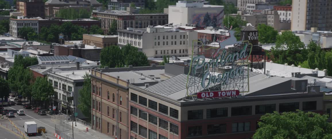 A large city logo sign on top of a building