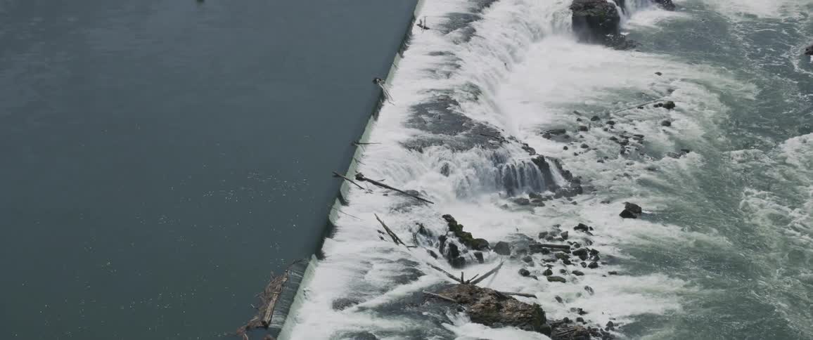 Water falls over a reservoir near town