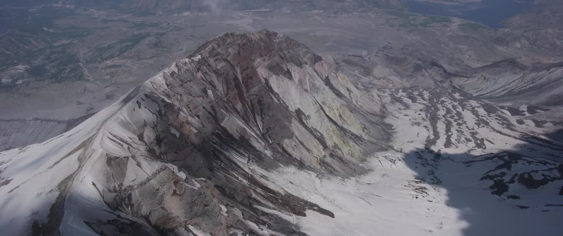 A mountain towers over the surrounding area