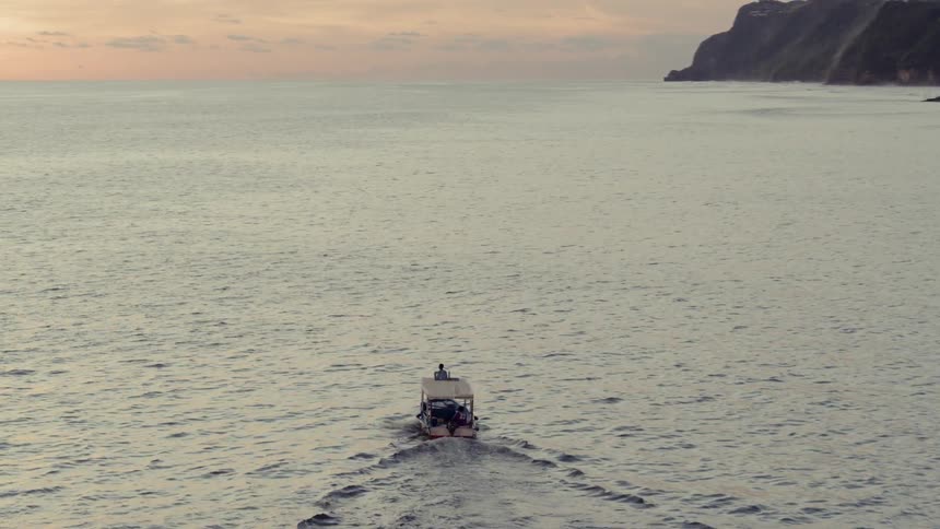 A boat flows through the water