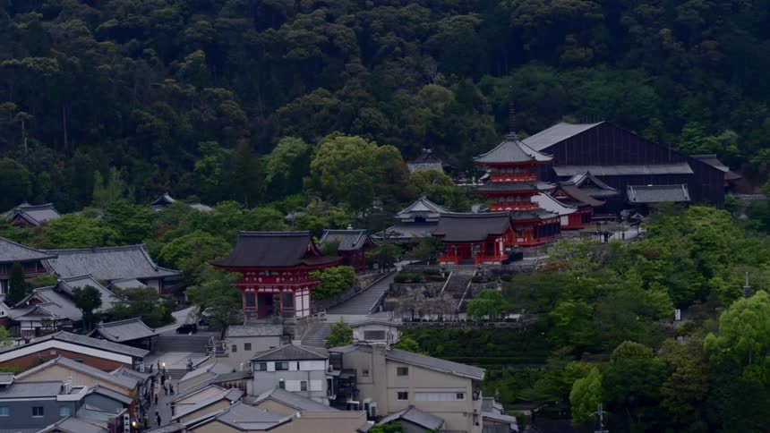 The camera flies over asian buildings