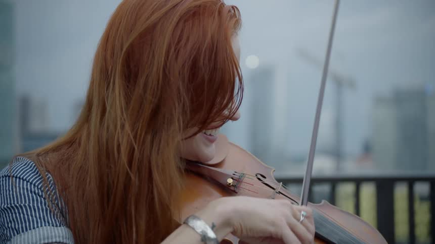 A woman plays the violin