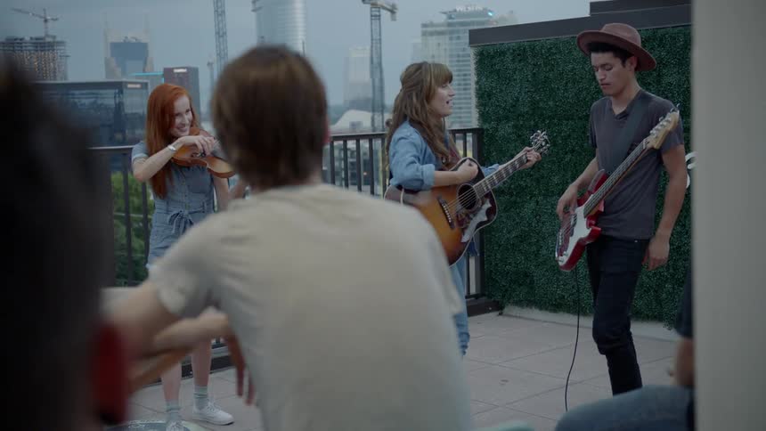 A small band playing for a small crowd