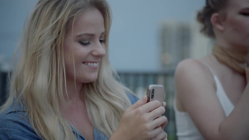 A young woman takes a selfie