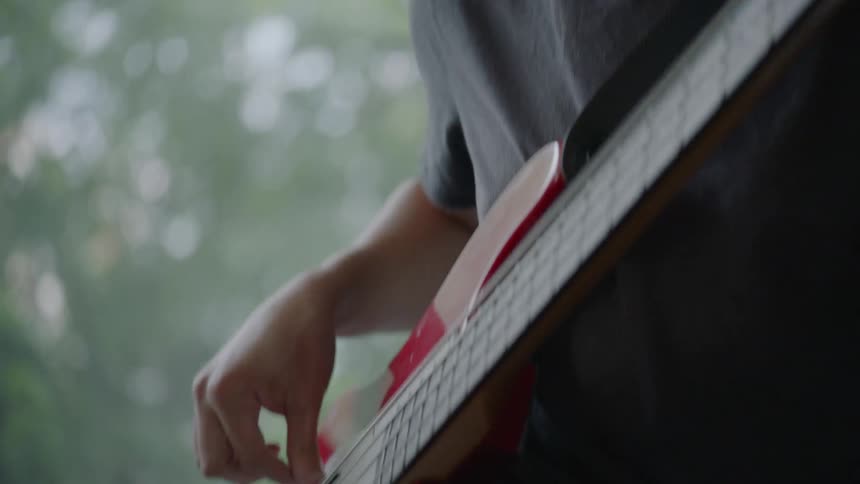Man in a hat playing electric guitar