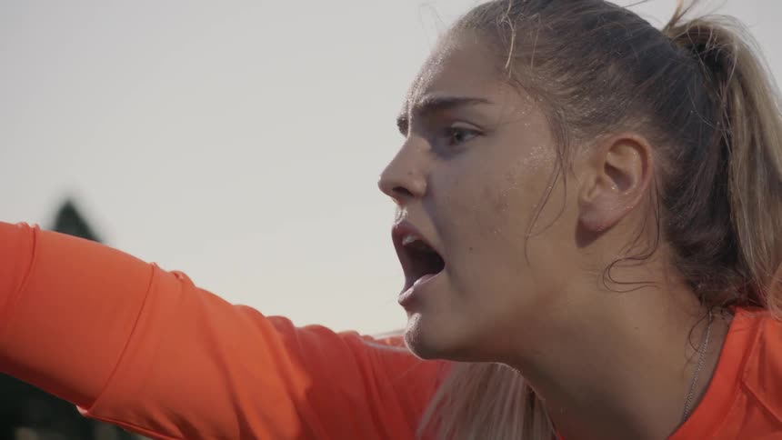 A woman yells intensely