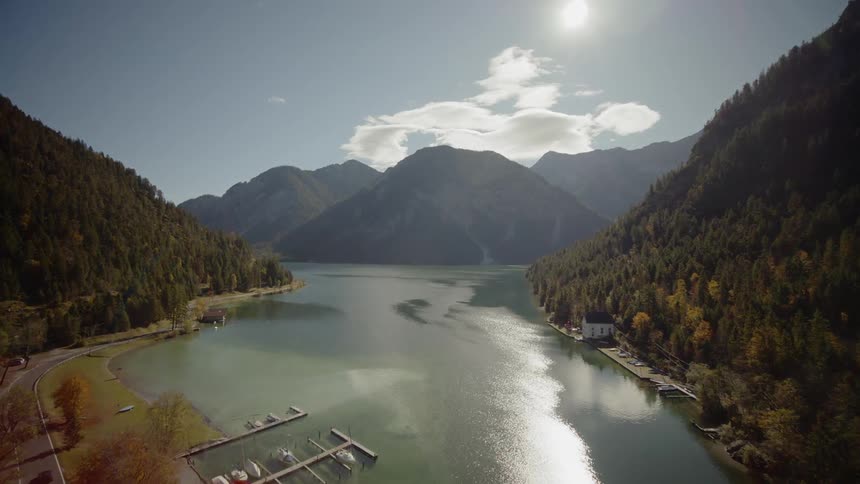Mountains loom over a river valley