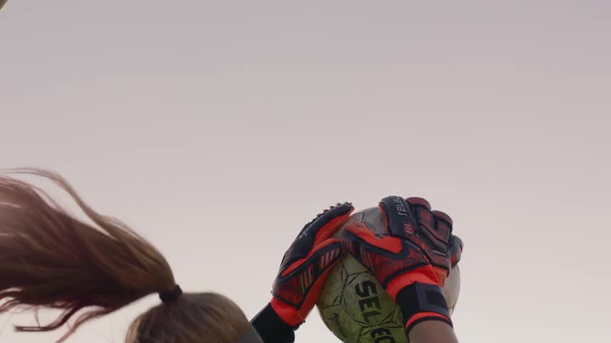 Goalie catches soccer ball