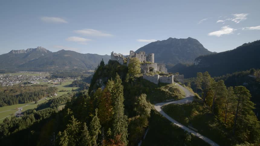 A castle sits on top of a mountain