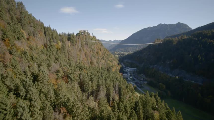 A narrow bridge connects two mountains