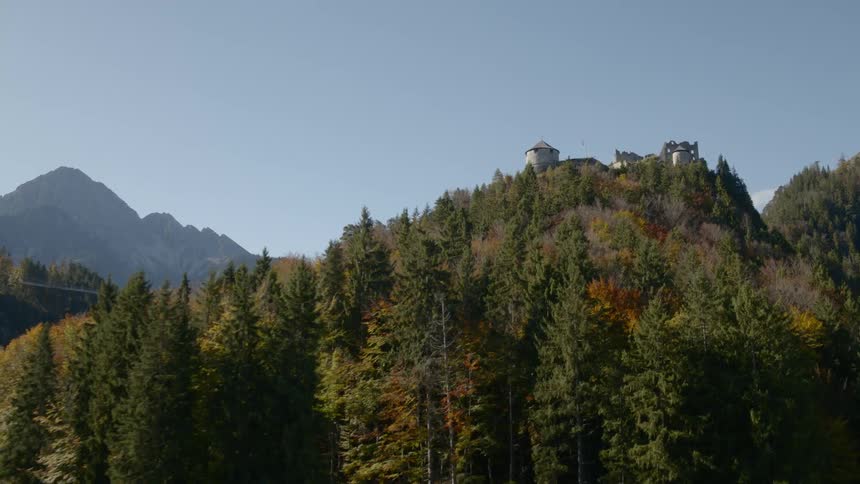 The trees are just starting to turn orange on this early autumn day and the hills are still green