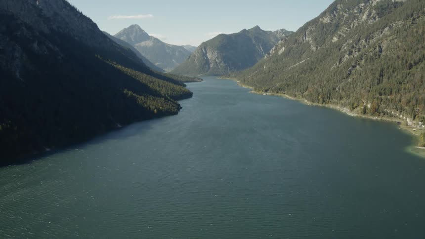 A lake sits in a mountain valley