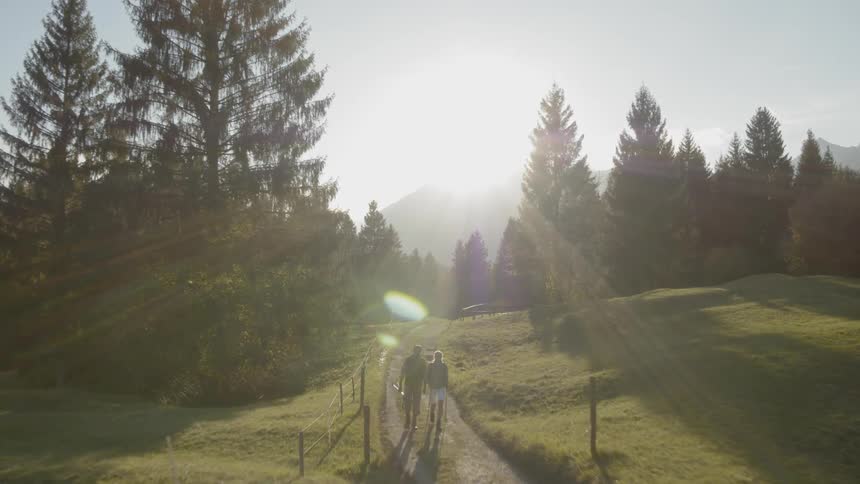 People are walking on a trail outdoors
