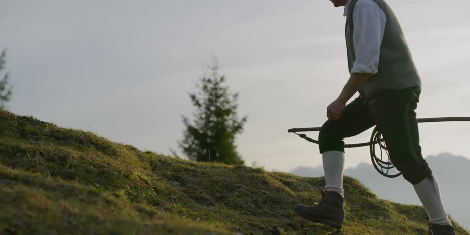 A man walks up a hill