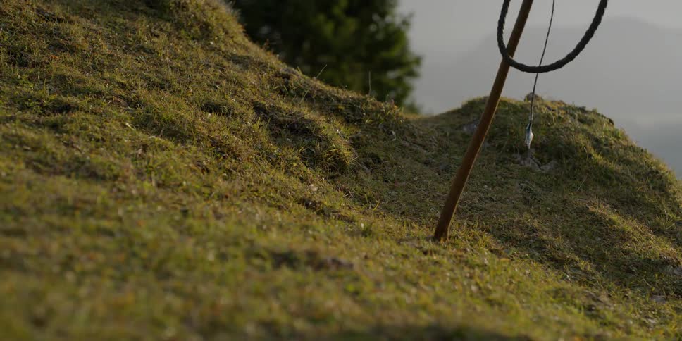 A man hikes up the hillside