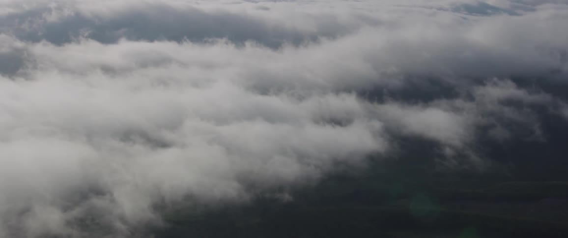 Birds eye view of clouds and fields