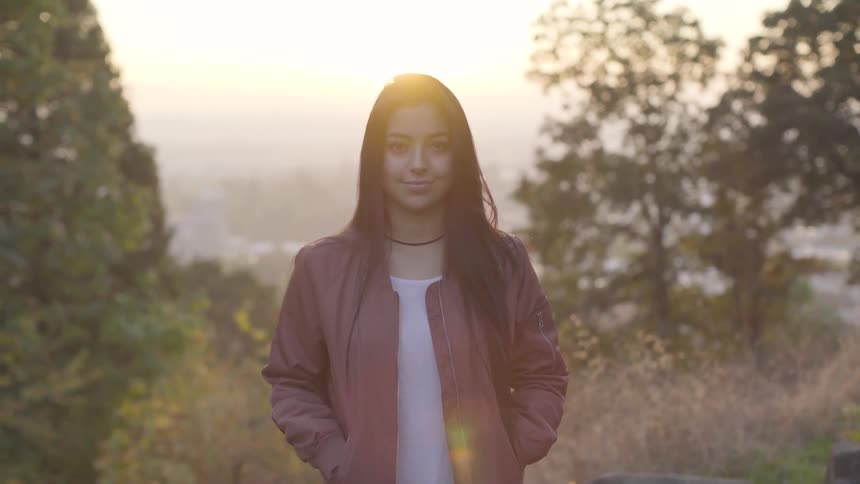 A woman smiles for the camera