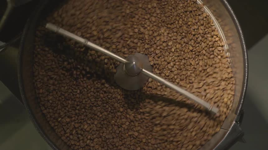 Coffee beans in a silver mixer