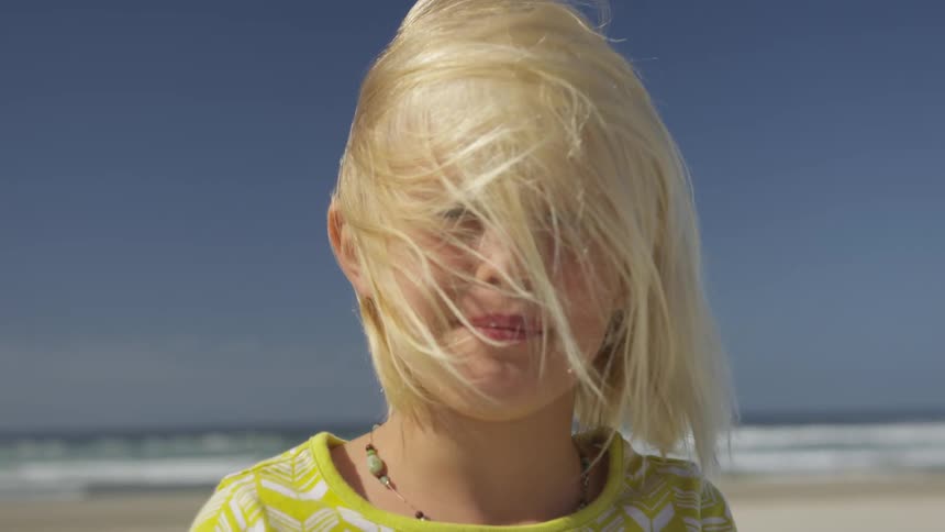 A girl has hair all over her face