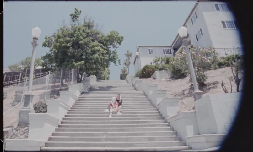A shot of two people on a staircase