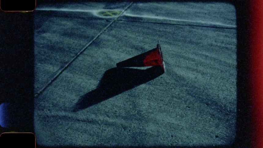 A traffic cone lays on its side