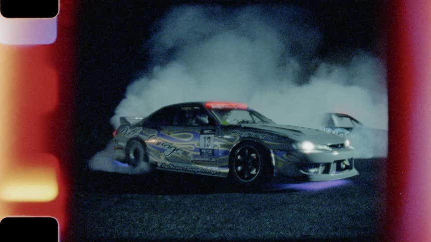 A vintage shot of a car revving