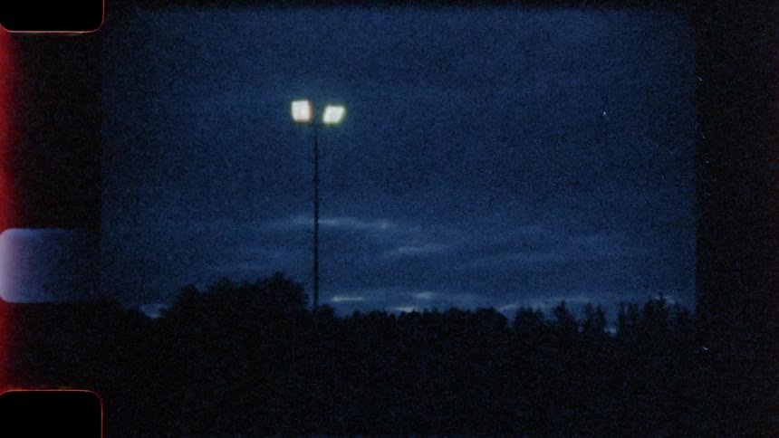 A parking lot light is lit up