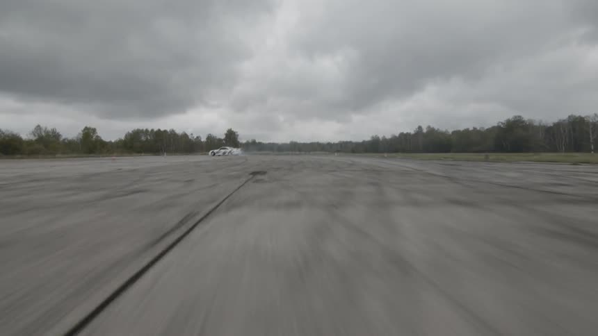 A car drifts around a turn