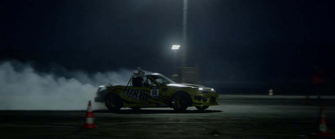 A slow motion shot of a car drifting