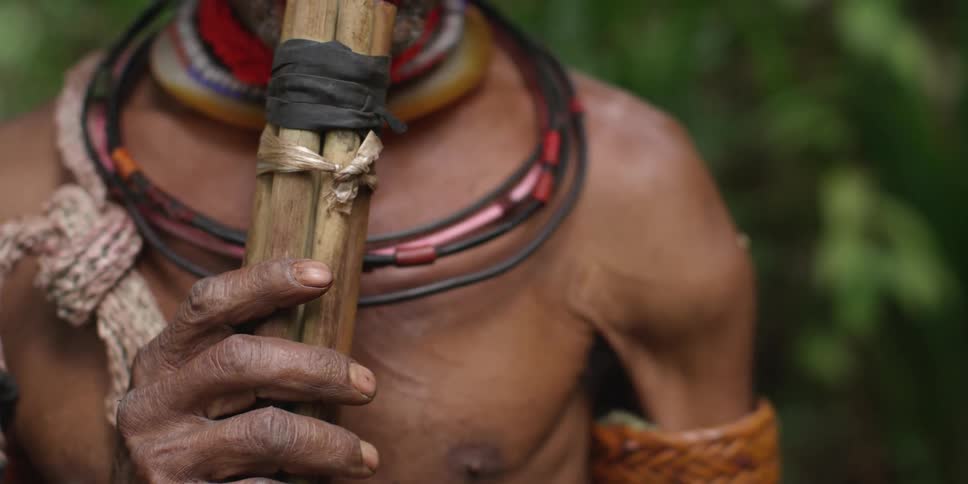 Close up of a tribesman's chest and face