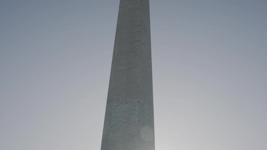 A tall monument at daytime with the sky in the background