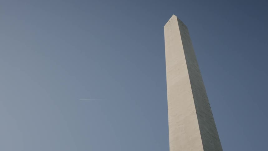 The tall tower reaches into the sunny sky
