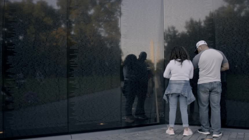 Couple standing next to a mural